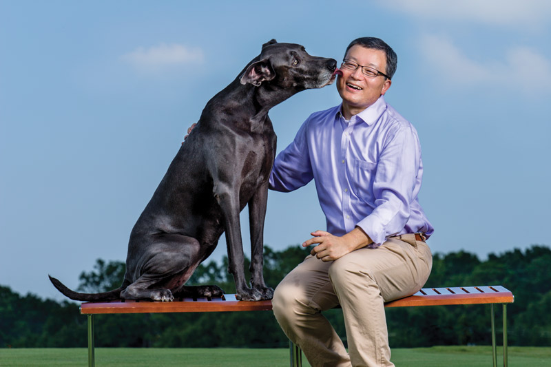 Biao He licked by dog