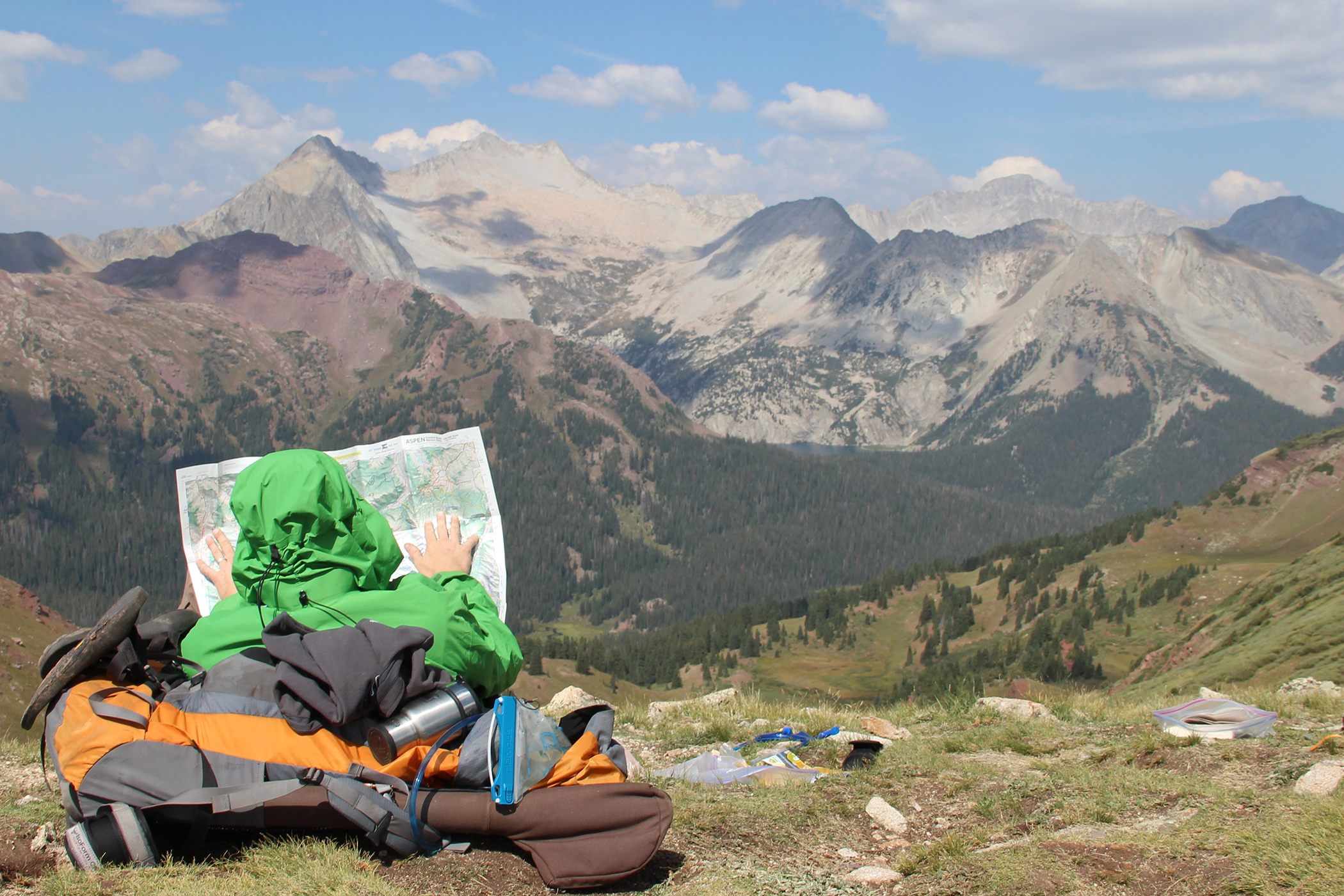 Tourist inspecting a map in the Rockies near Aspen Colorado