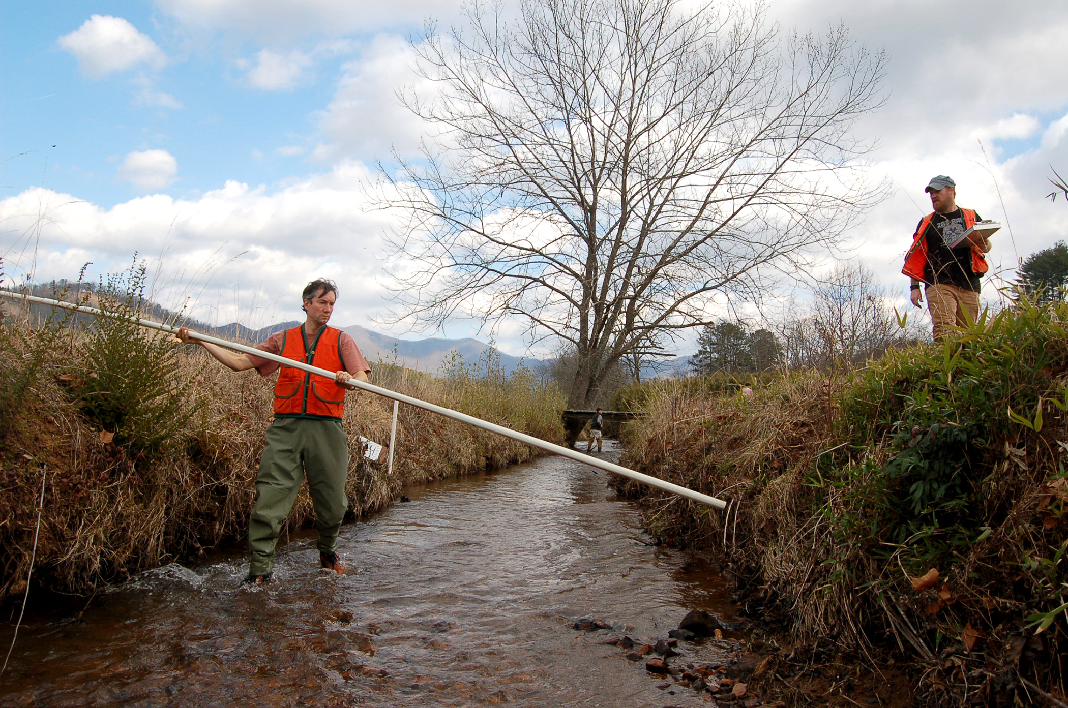 Researchers inspect stream