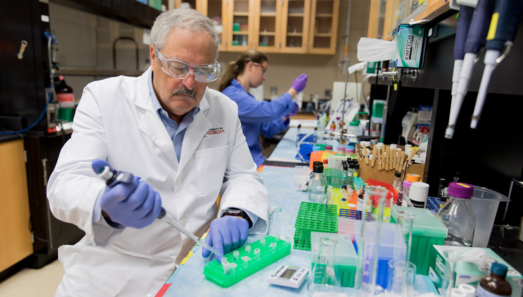 Portrait of Gerald Hart working at lab bench