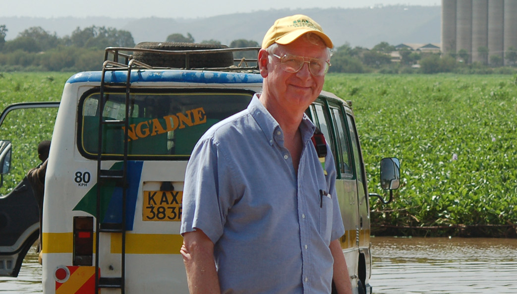 Daniel Colley visits a car wash in Kisumu, Kenya, one of his study sites for more than 20 years. Workers at the car wash drive vehicles into Lake Victoria, infecting and reinfecting themselves with schistosomiasis.